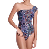 MARION asymmetric one piece, printed swimsuit by ALMA swimwear – front view 1