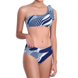 SOPHIE asymmetric bra, printed bikini top by ALMA swimwear – front view 1